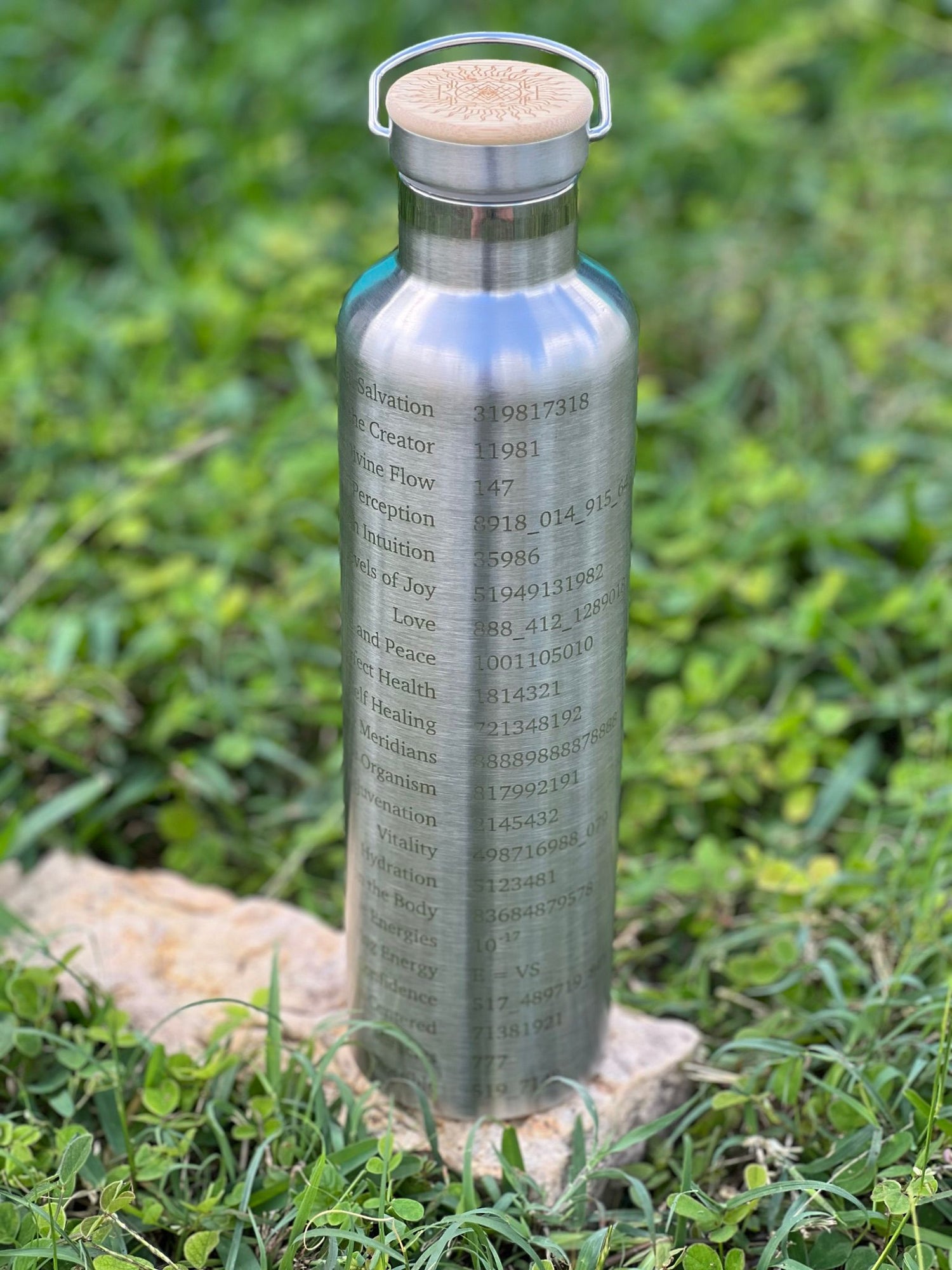 1L silver stainless steel Grabovoi bottle with engraved energy codes to transform water and support vibrational healing.