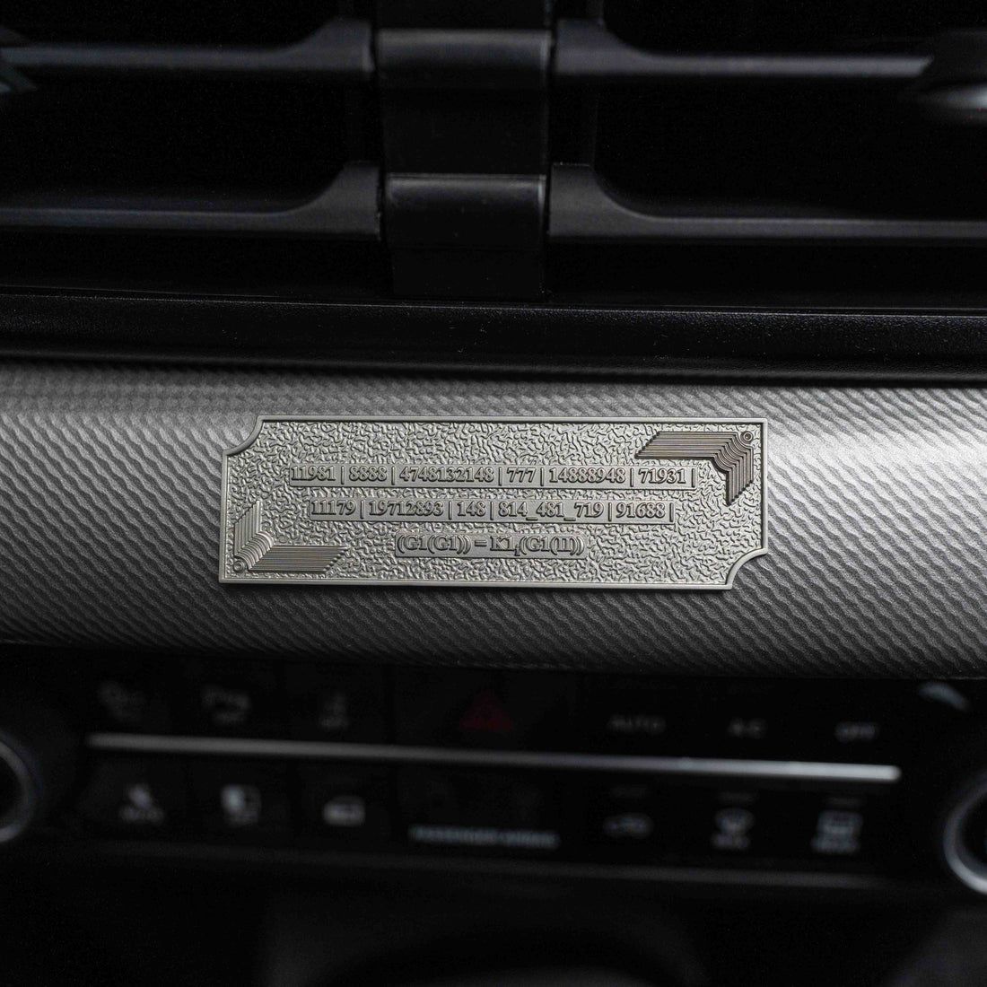 Metallic Grabovoi number charm for vehicles, designed to enhance protection, remove obstacles, and harmonize travel energy