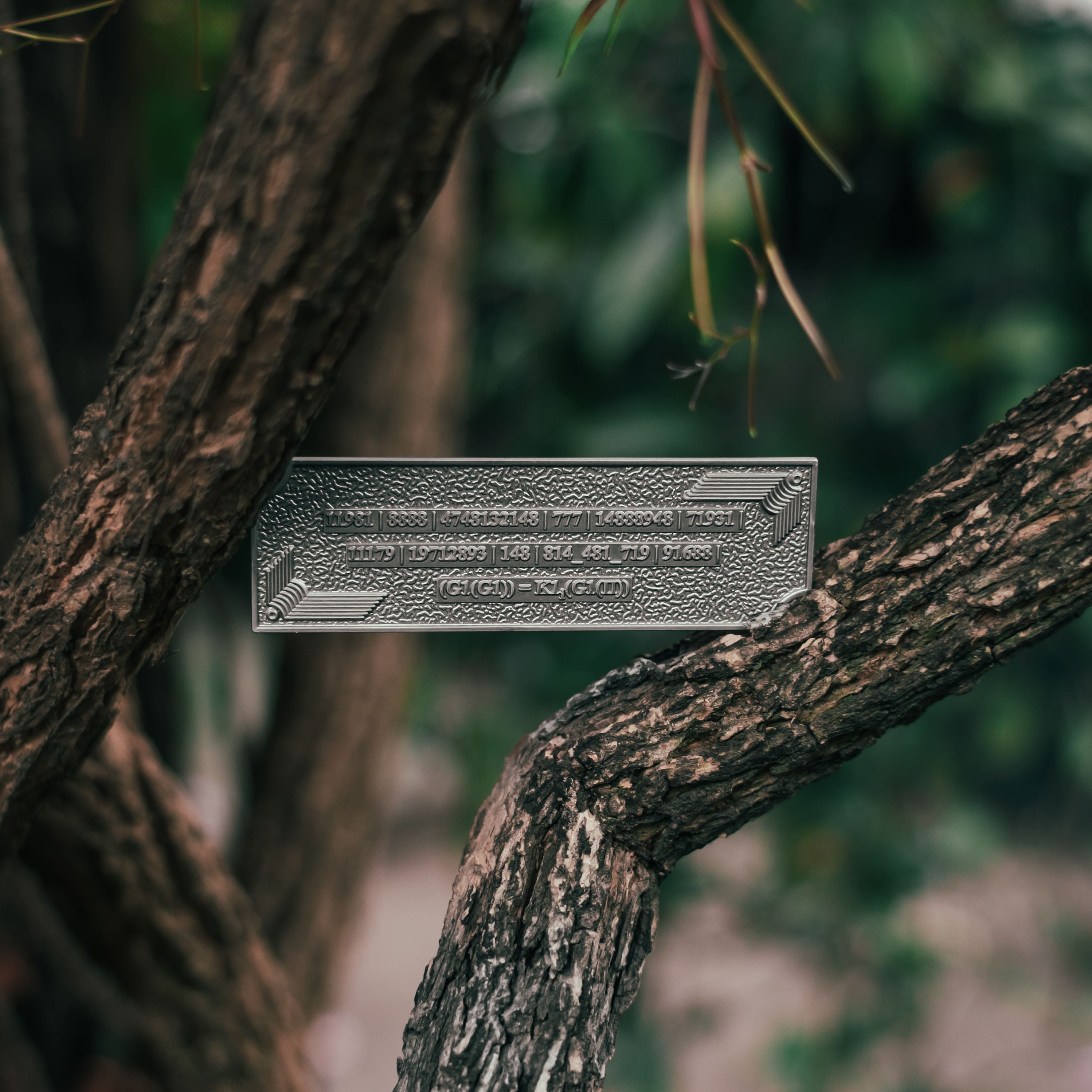 Metallic Grabovoi number charm for vehicles, designed to enhance protection, remove obstacles, and harmonize travel energy