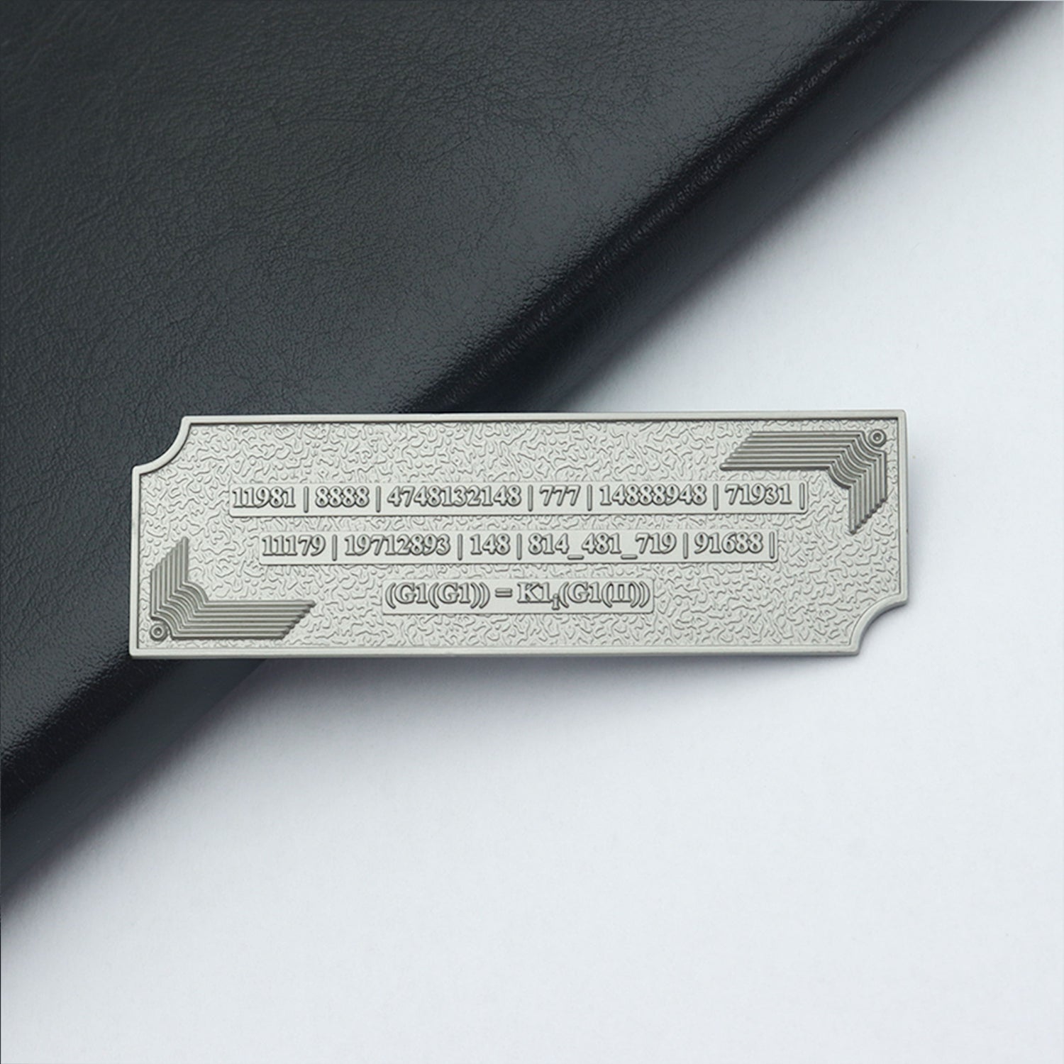 Metallic Grabovoi number charm for vehicles, designed to enhance protection, remove obstacles, and harmonize travel energy