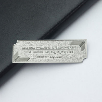 Metallic Grabovoi number charm for vehicles, designed to enhance protection, remove obstacles, and harmonize travel energy