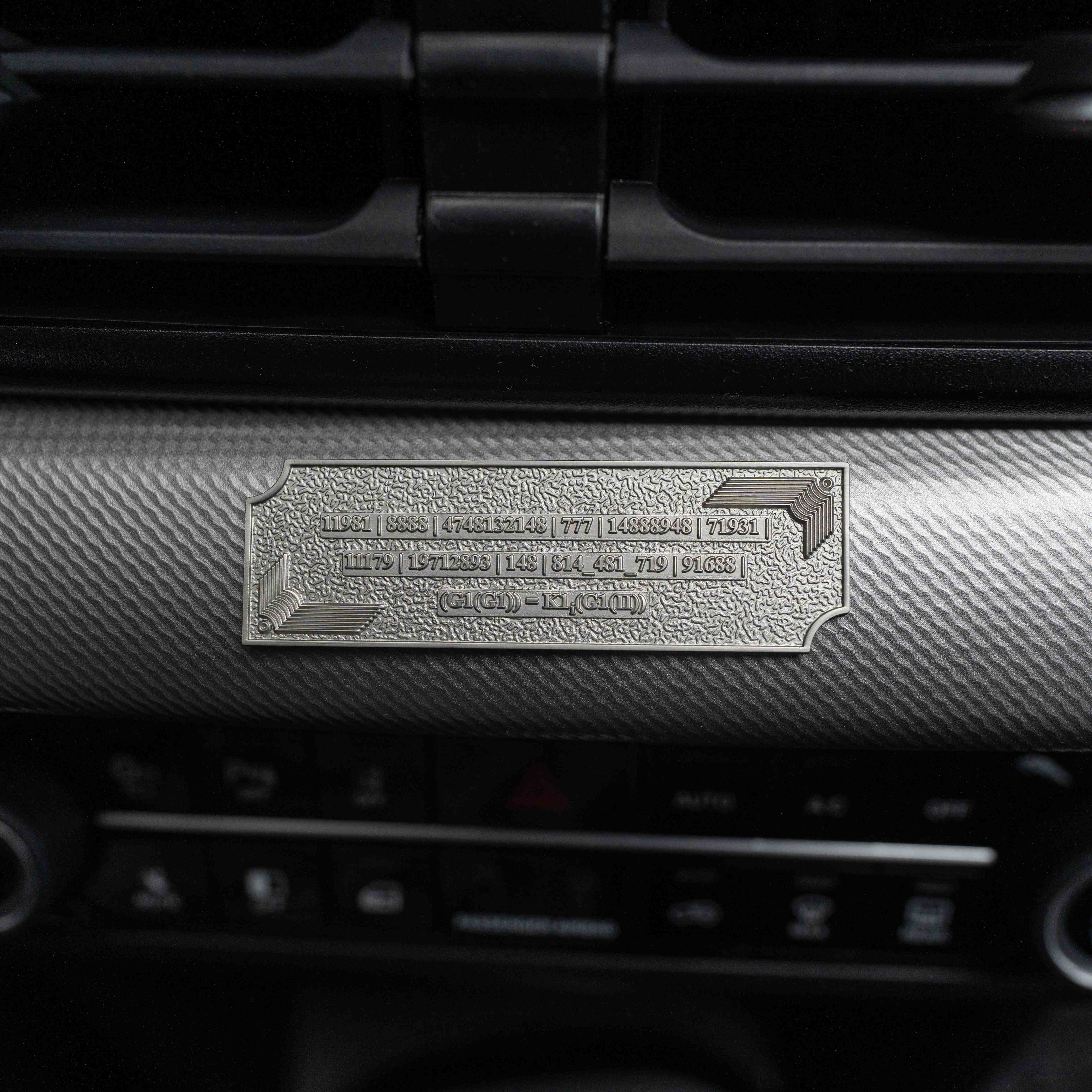 Metallic Grabovoi number charm for vehicles, designed to enhance protection, remove obstacles, and harmonize travel energy